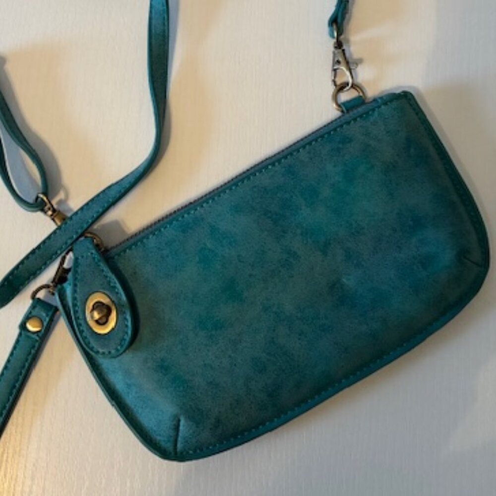 Joy crossbody purse blue suede with detachable straps.